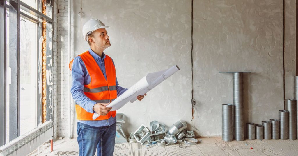 Restoration inspector reviewing commercial property