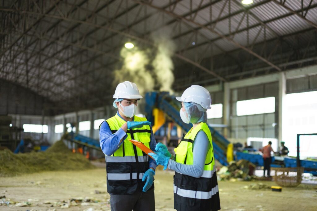 Restoration specialists assessing damage inside a large industrial facility